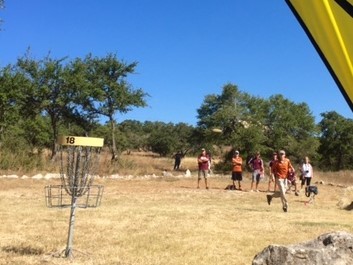 Texas' Name Here launches a 40-foot putt to force a playoff at the Texas Collegiate Disc Golf Championship. Photo: Jay Reading