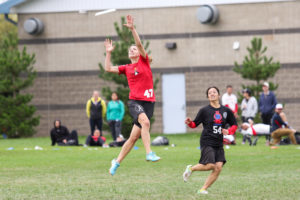 Mischief's Gina Schumacher skies for the disc in their semifinal against Metro North. Photo: Paul Rutherford -- UltiPhotos.com