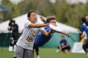 Claire Chastain of Molly Brown bids for a block against Scandal's Amy Zhou in the 2016 Club Championships quarterfinals.